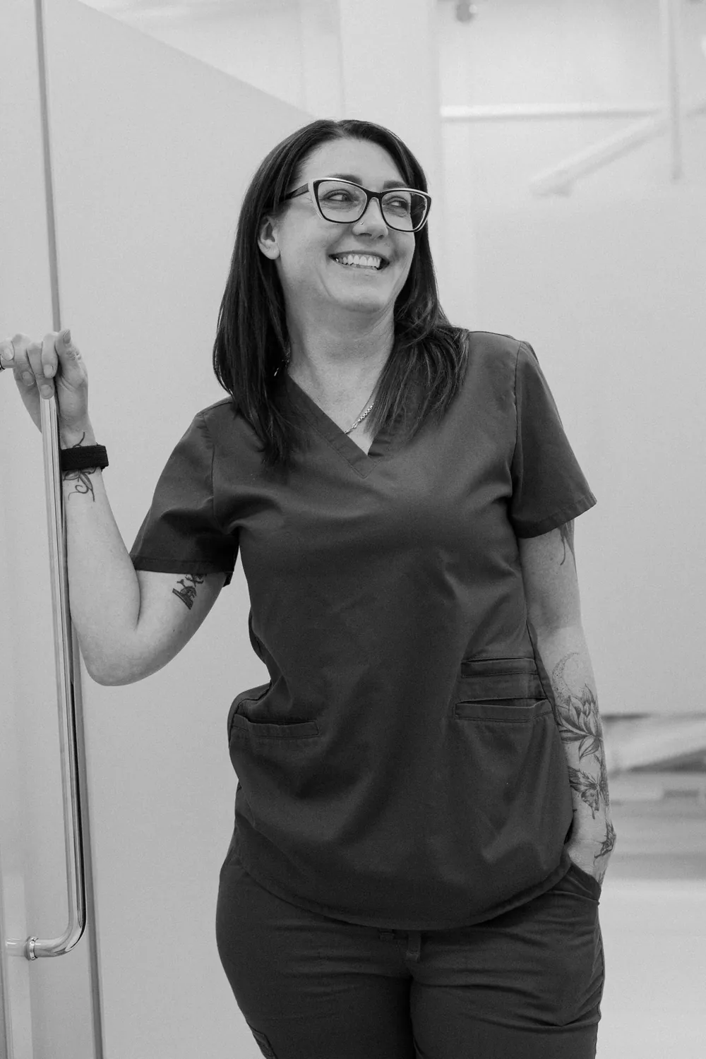 Smiles @ Southgate dental assistant leaning on a treatment room door
